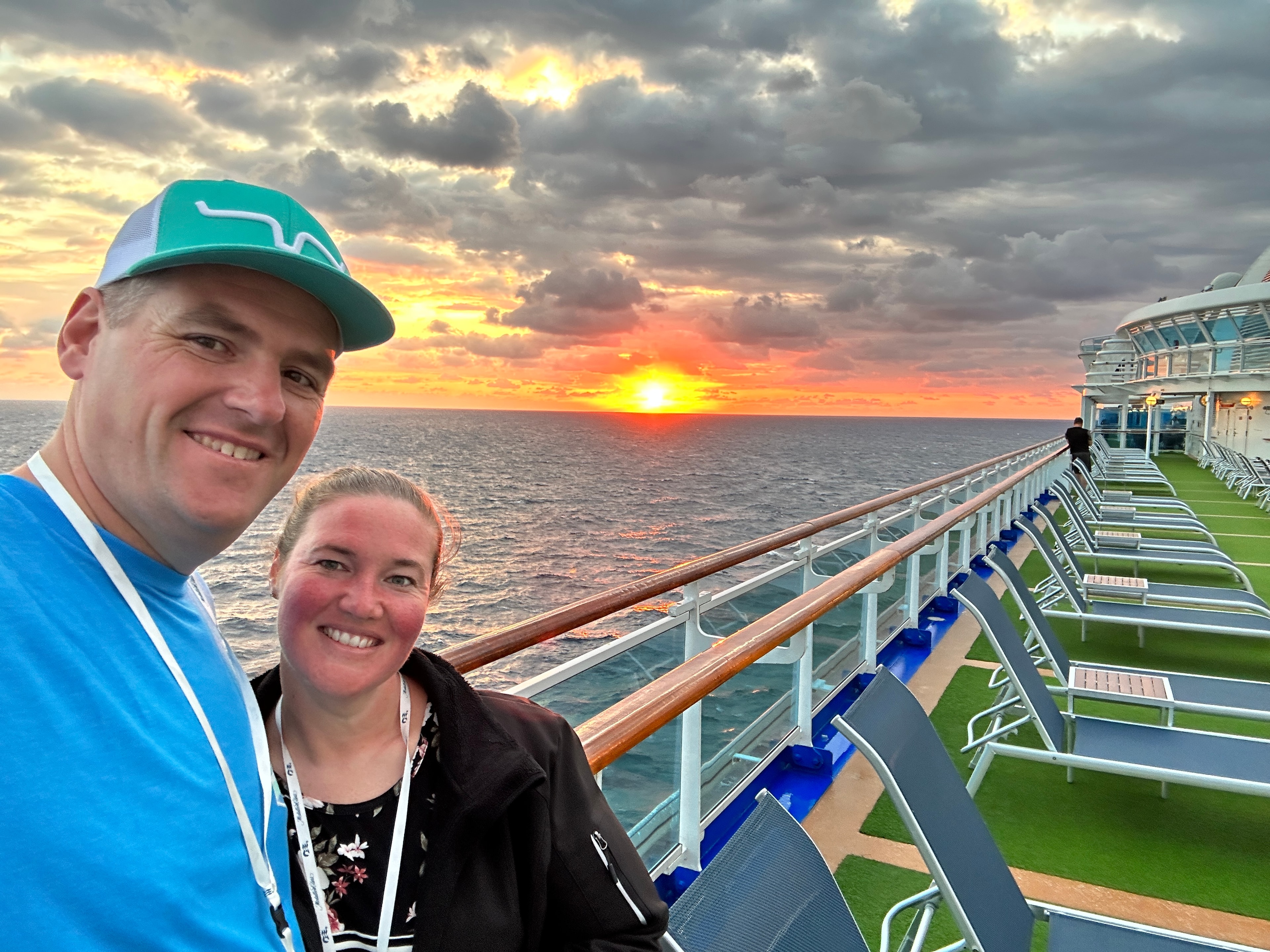 Couple watching sunset from cruise ship deck