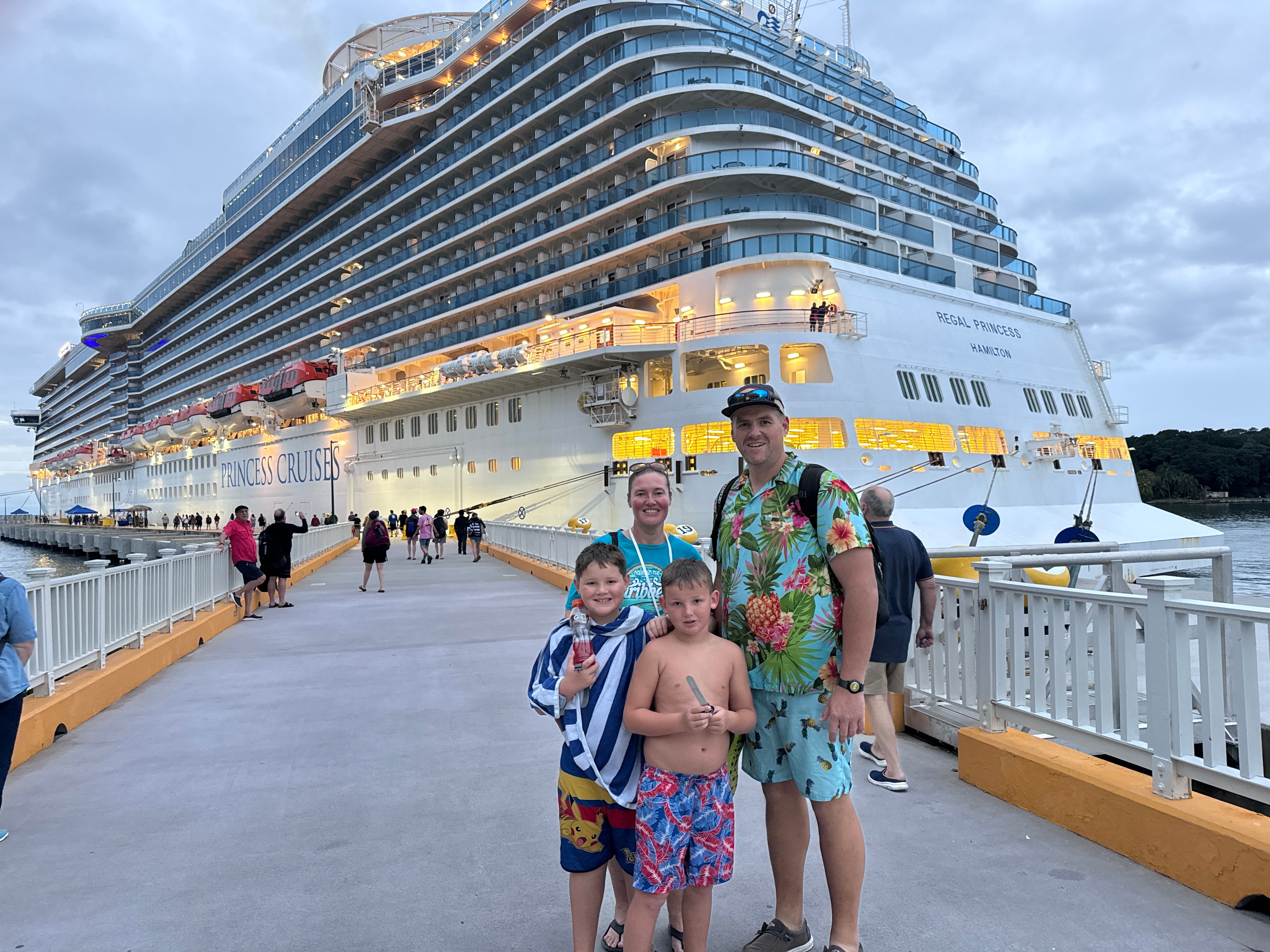 Family posing in front of Princess Cruises ship